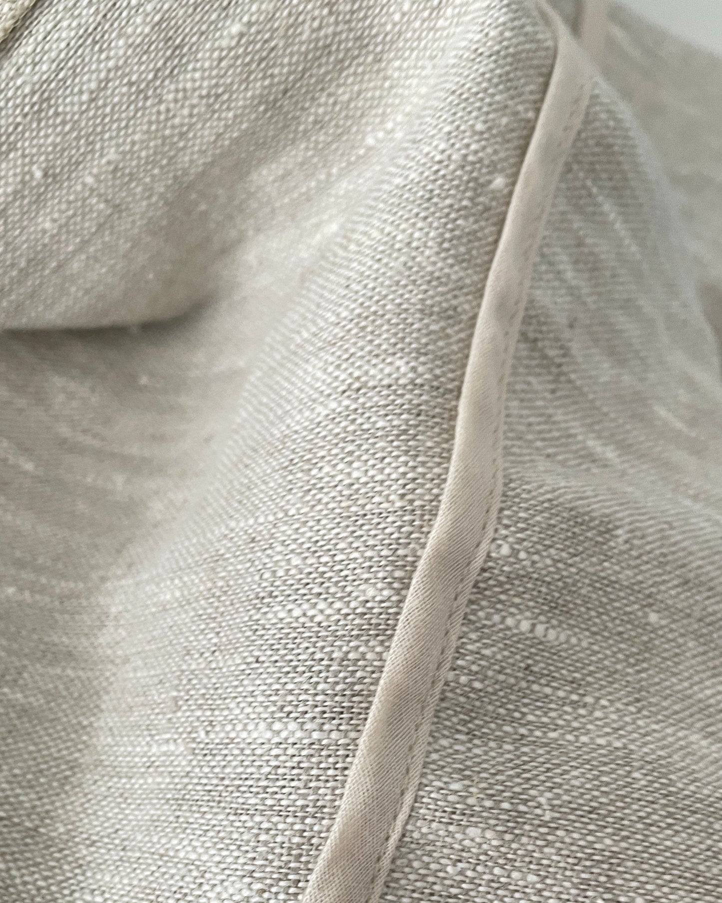 Seam and stitching detail on natural European linen skirt