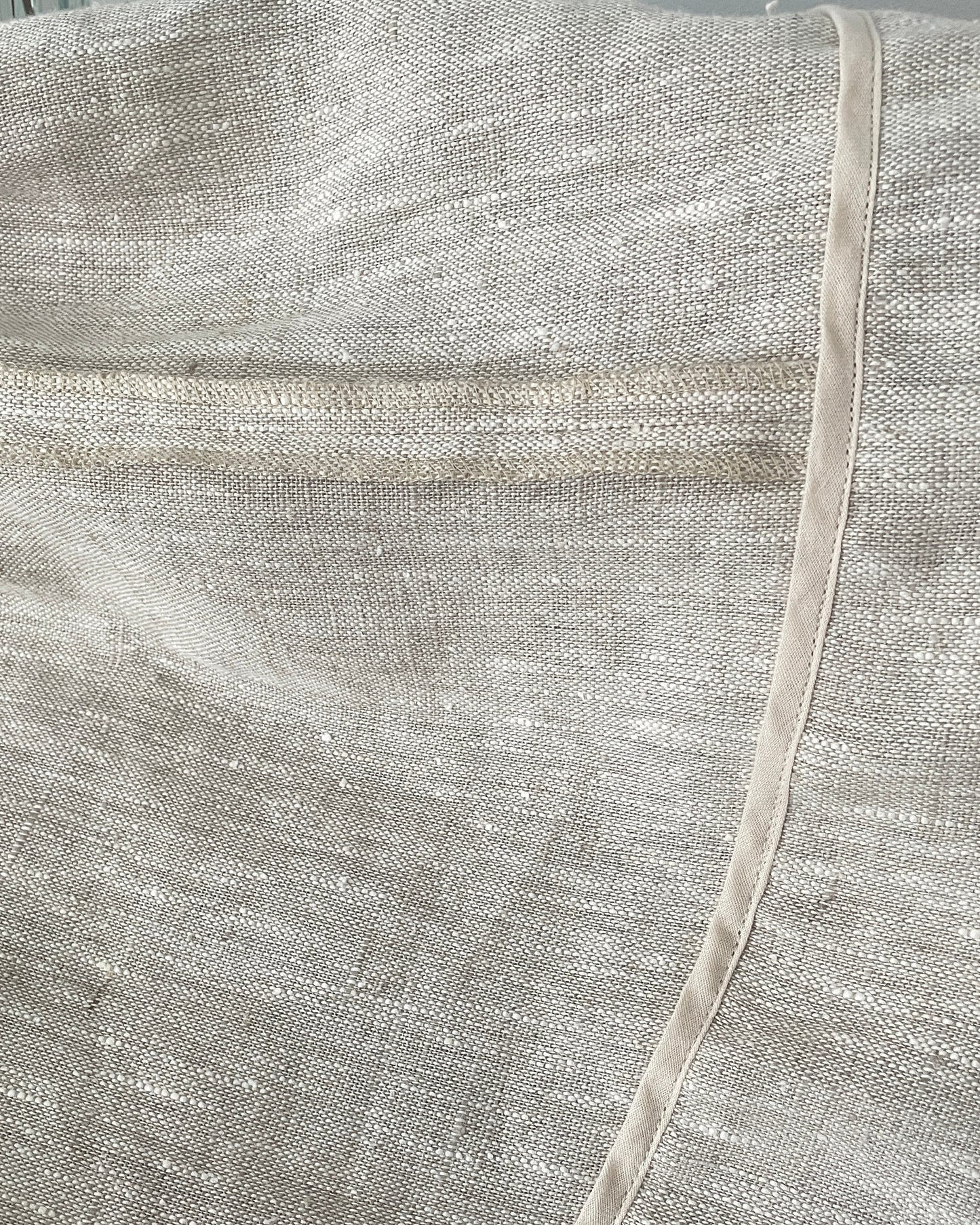 Asymmetrical hemline and finishing detail on linen skirt