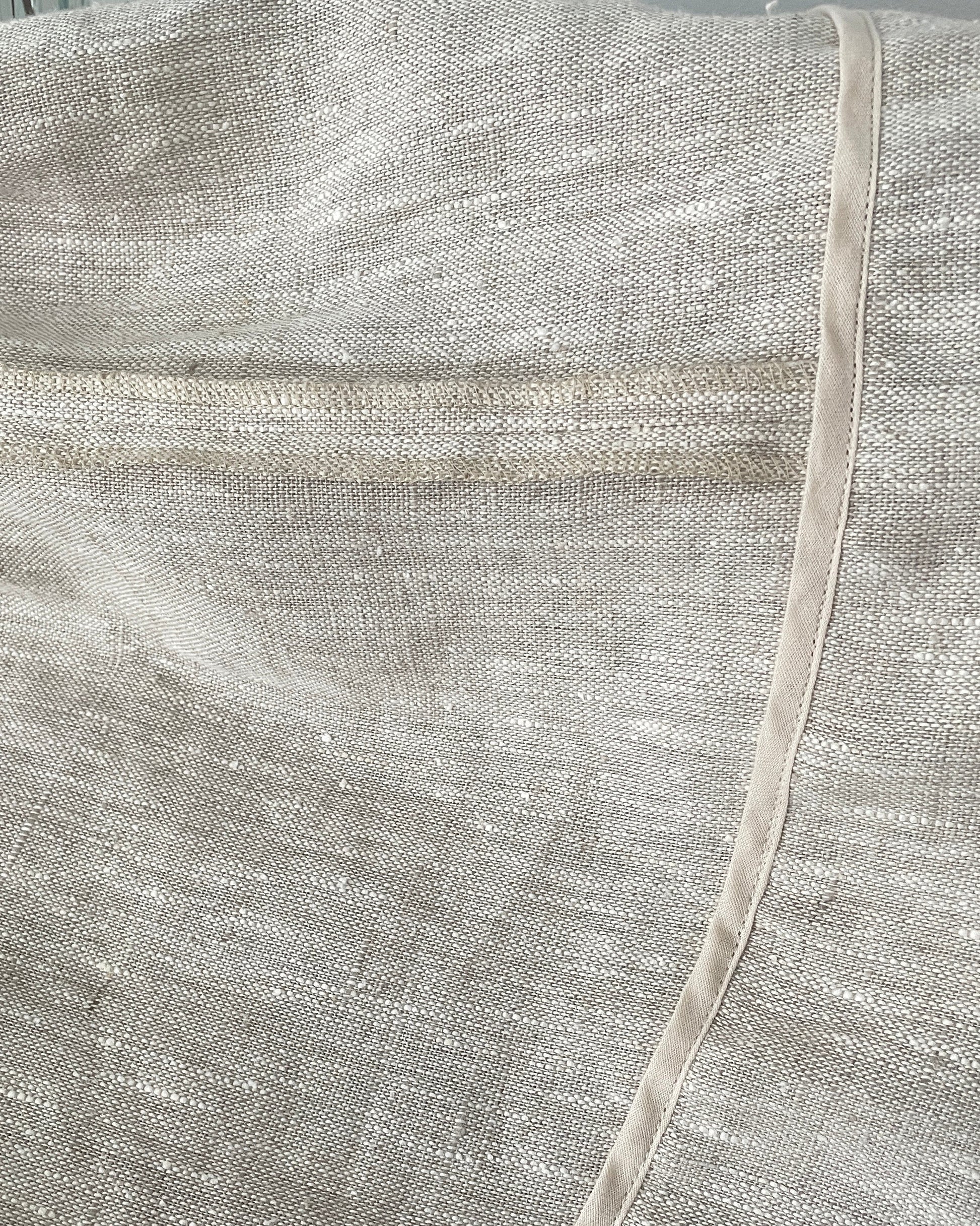 Asymmetrical hemline and finishing detail on linen skirt