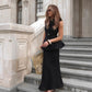 Black sleeveless linen peplum top with fitted waist and maxi linen skirt
