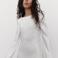 Close-up of a silk mini wedding dress with a boat neckline and elegant flared sleeves.