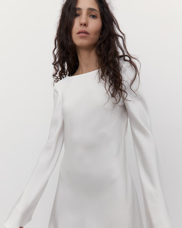 Close-up of a silk mini wedding dress with a boat neckline and elegant flared sleeves.