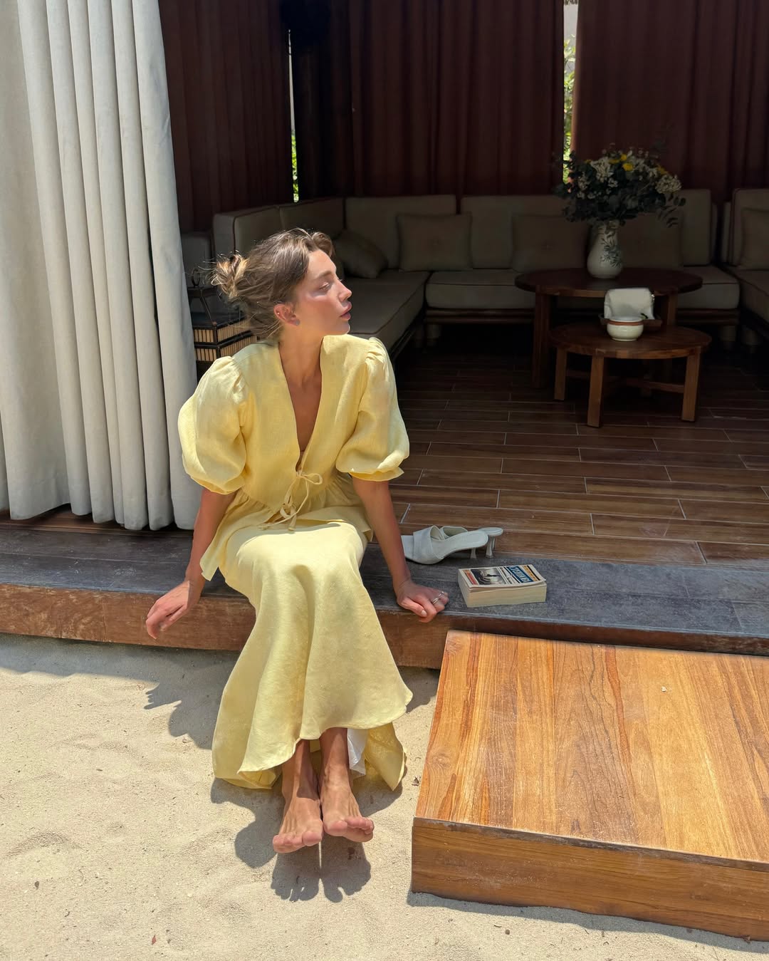 Butter yellow linen set with a relaxed tie front top and flowing midi skirt.
