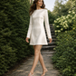Minimalist satin mini wedding dress with long sleeves for a modern bride