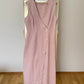 Dusty pink sleeveless linen wrap maxi dress on a hanger.