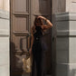 Minimal black linen peplum top with structured silhouette