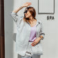 Woman styling a grey linen co-ord set with relaxed silhouette