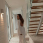 SOPHIE white linen wedding dress with long sleeves, open back and softly flared skirt – back view