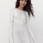 Minimalist silk mini wedding dress photographed in studio.