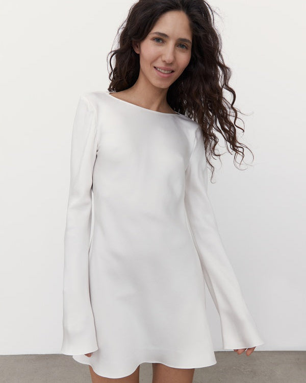 Minimalist silk mini wedding dress photographed in studio.
