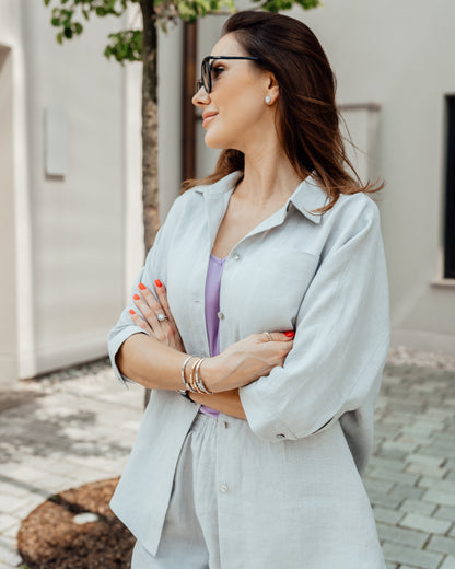 Elegant grey linen two-piece outfit with relaxed pants and button shirt