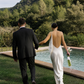 Full length back view of an ivory backless silk maxi dress.