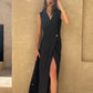 Full-length black linen wrap maxi dress with relaxed silhouette.