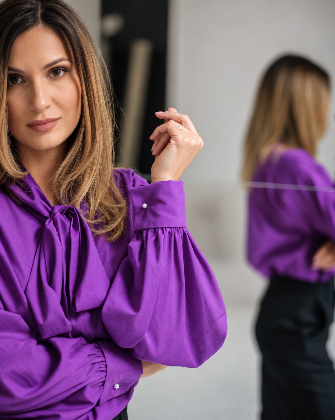 Purple ascot blouse with voluminous sleeves and folded French cuffs with pearl cufflinks