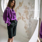 Purple cotton blouse with sculptural shoulder draping, long ascot ties and voluminous sleeves
