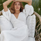 White linen wrap dress with V neck and voluminous puff sleeves