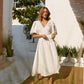 White linen wrap midi dress with puff sleeves front view