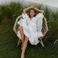White linen wrap midi dress with voluminous puff sleeves